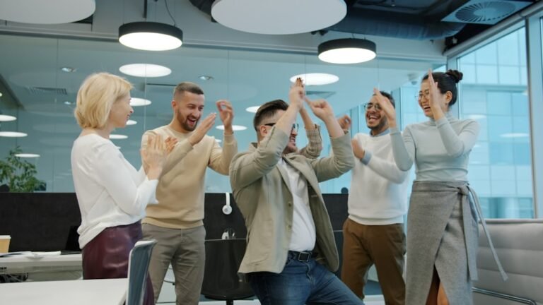 colleagues celebrating success in an office