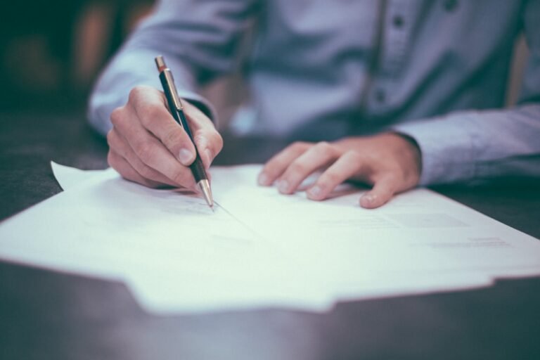 filling out a form by hand
