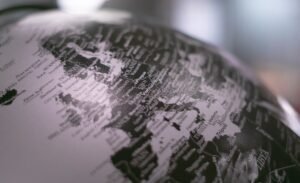 grayscale photo of a desk globe